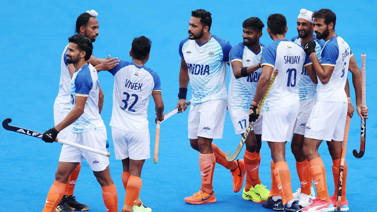 Mandeep Singh of Team India (2R) celebrates scoring his team's first goal with teammates during the Men's Pool B match between India and New Zealand on day one of the Olympic Games Paris 2024 at Stade Yves Du Manoir on July 27