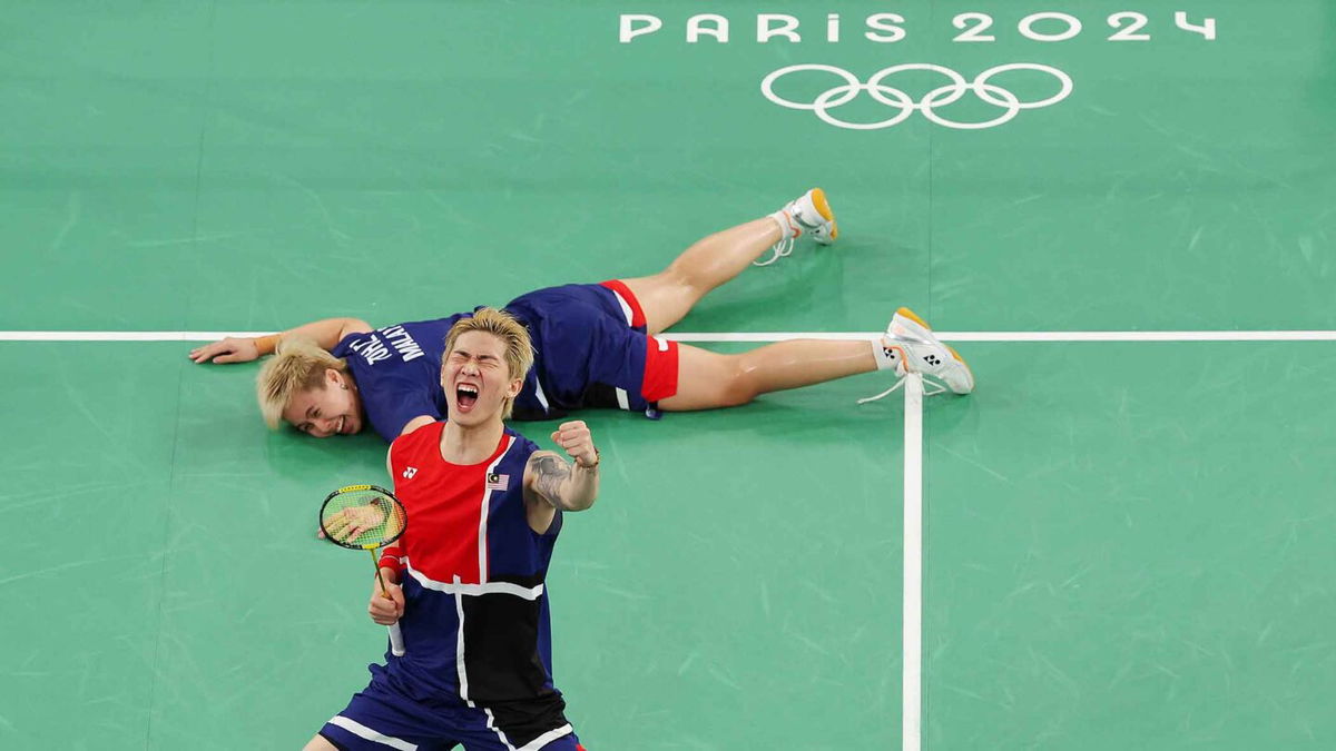 Tang Jie Chen and Ee Wei Toh of Team Malaysia celebrate during the Mixed Doubles Group Play Stage - Group D match between Team People’s Republic of China and Team Malaysia on day three of the Olympic Games Paris 2024 at Porte de La Chapelle Arena on July 29