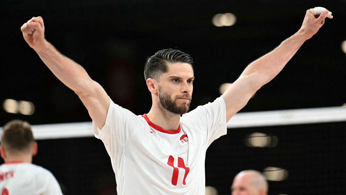 Poland's #11 Aleksander Sliwka celebrates during the men's preliminary round volleyball match between Poland and Brazil during the Paris 2024 Olympic Games at the South Paris Arena 1 in Paris on July 31