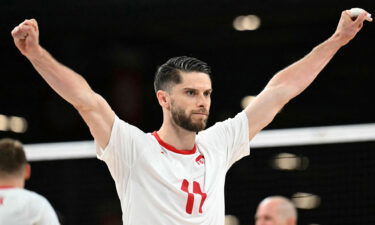 Poland's #11 Aleksander Sliwka celebrates during the men's preliminary round volleyball match between Poland and Brazil during the Paris 2024 Olympic Games at the South Paris Arena 1 in Paris on July 31