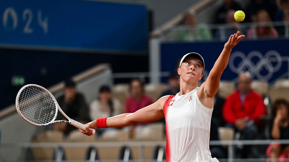 Iga Swiatek of Poland in action against Irina-Camelia Begu of Romania in the Women's Singles first round match on day one of the Olympic Games Paris 2024 at Roland Garros on July 27