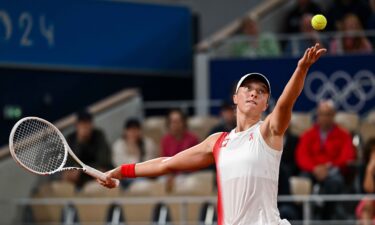 Iga Swiatek of Poland in action against Irina-Camelia Begu of Romania in the Women's Singles first round match on day one of the Olympic Games Paris 2024 at Roland Garros on July 27