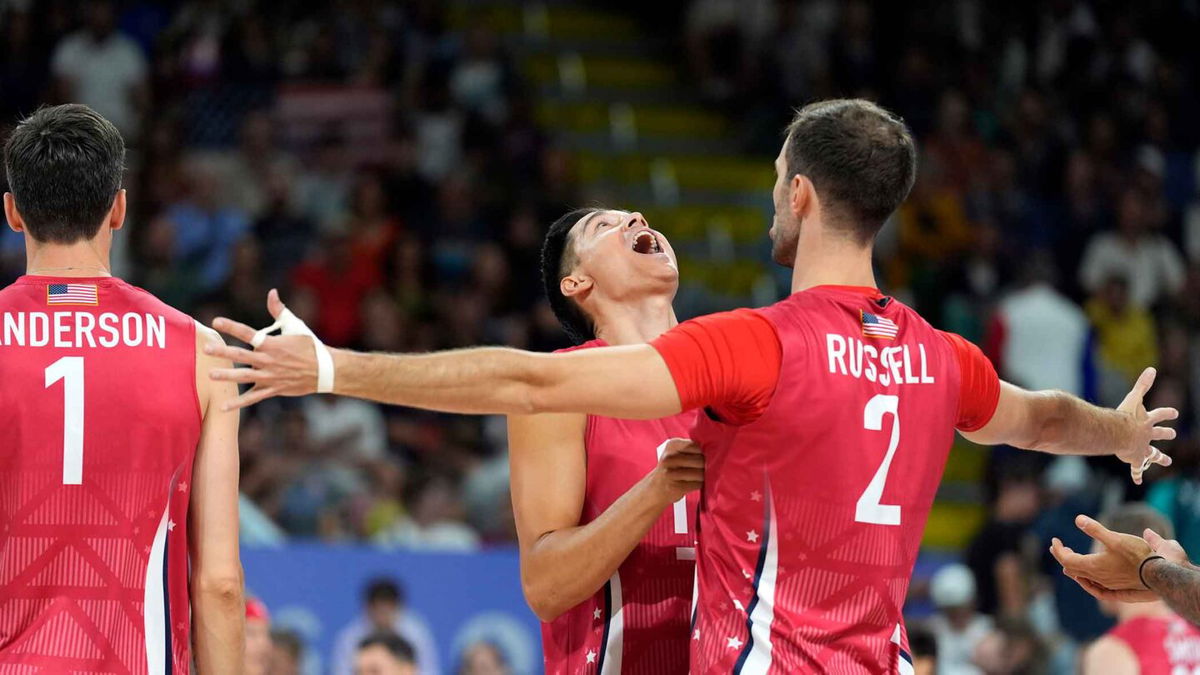 United States of America setter Micah Christenson (11) and outside hitter Aaron Russell (2) react before the match against Argentina during the Paris 2024 Olympic Summer Games at South Paris Arena 1.