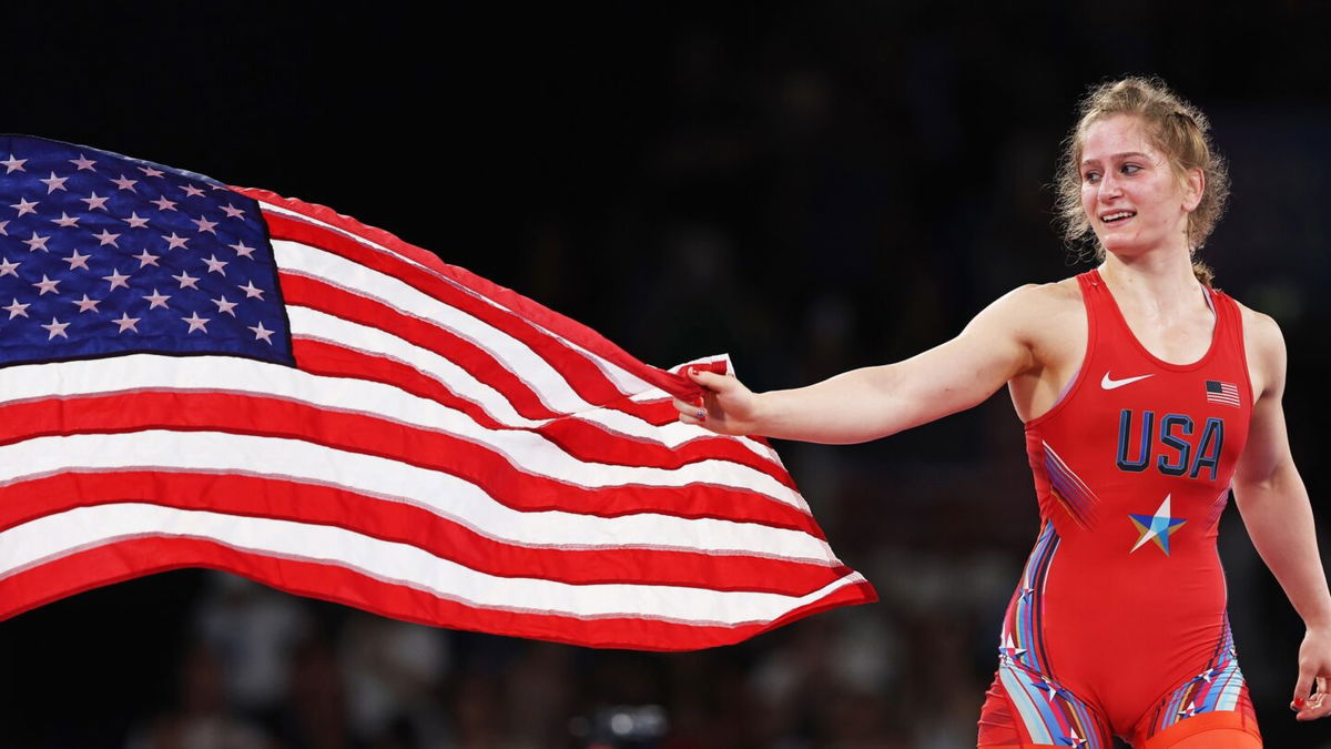 Amit Elor waves American flag