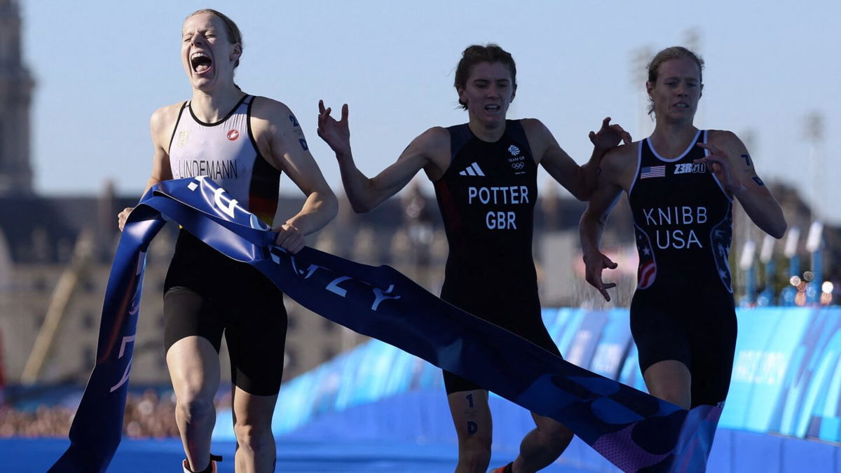 A photo finish at the tape during mixed relay triathlon