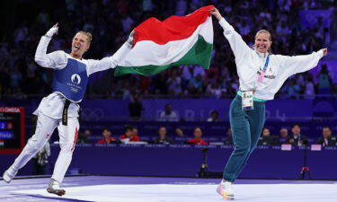 Viviana Marton celebrates with flag at 2024 Paris Olympic Games