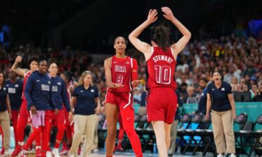 A'ja Wilson and Breanna Stewart high-five during U.S. game