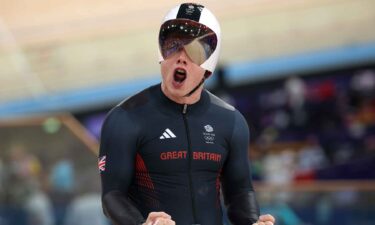 Jack Carlin celebrates winning the bronze medal in the men's sprint.