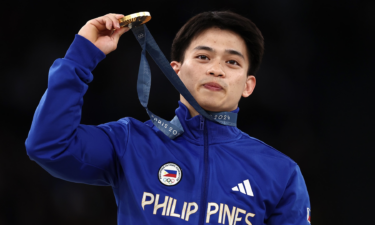 Carlos Yulo with a gold medal