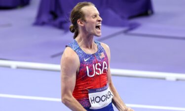 Cole Hocker celebrates after winning gold in the men's 1500m