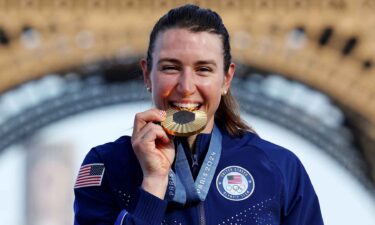 Kristen Faulkner posed with her gold medal