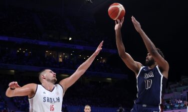 Joel Embiid shoots over Nikola Jokic