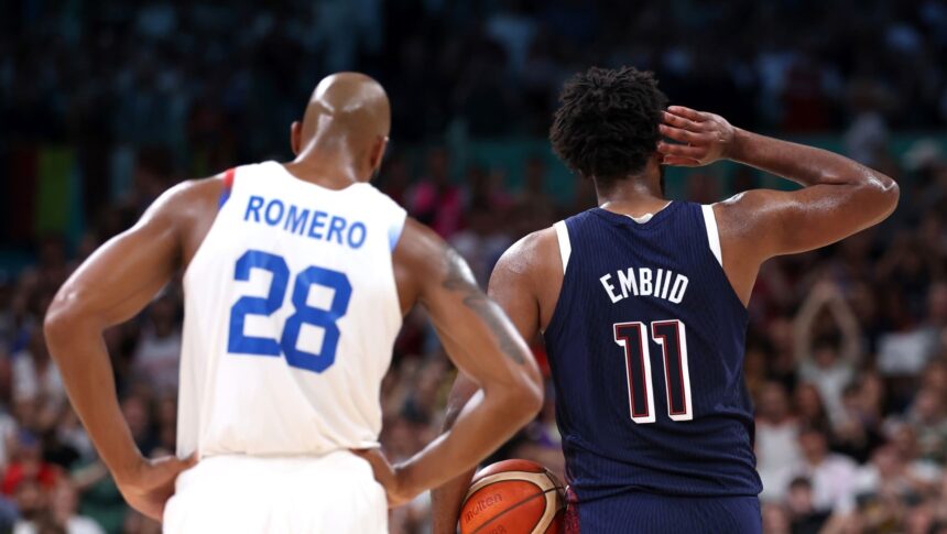 Joel Embiid gestures to the crowd