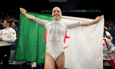 Kaylia Nemour of Algeria celebrates after winning an historic gold medal on uneven bars at the Paris 2024 Olympics.