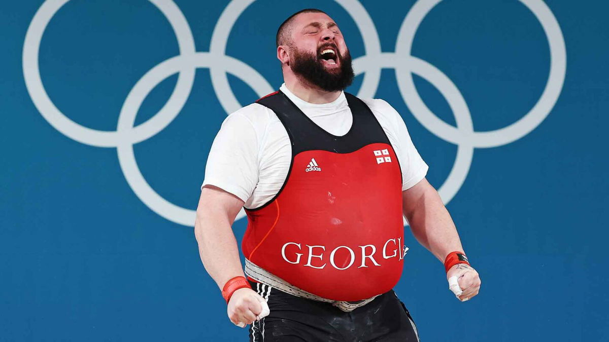 Lasha Talakhadze of Georgia celebrates after performing a lift at the 2024 Paris Olympics.