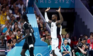 LeBron James celebrates a dunk vs. South Sudan