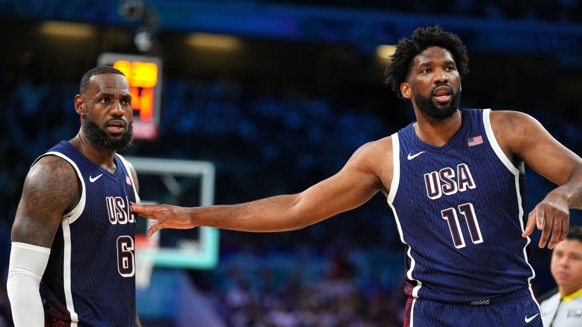 LeBron James and Joel Embiid talk during game vs. Serbia