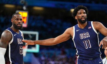 LeBron James and Joel Embiid talk during game vs. Serbia