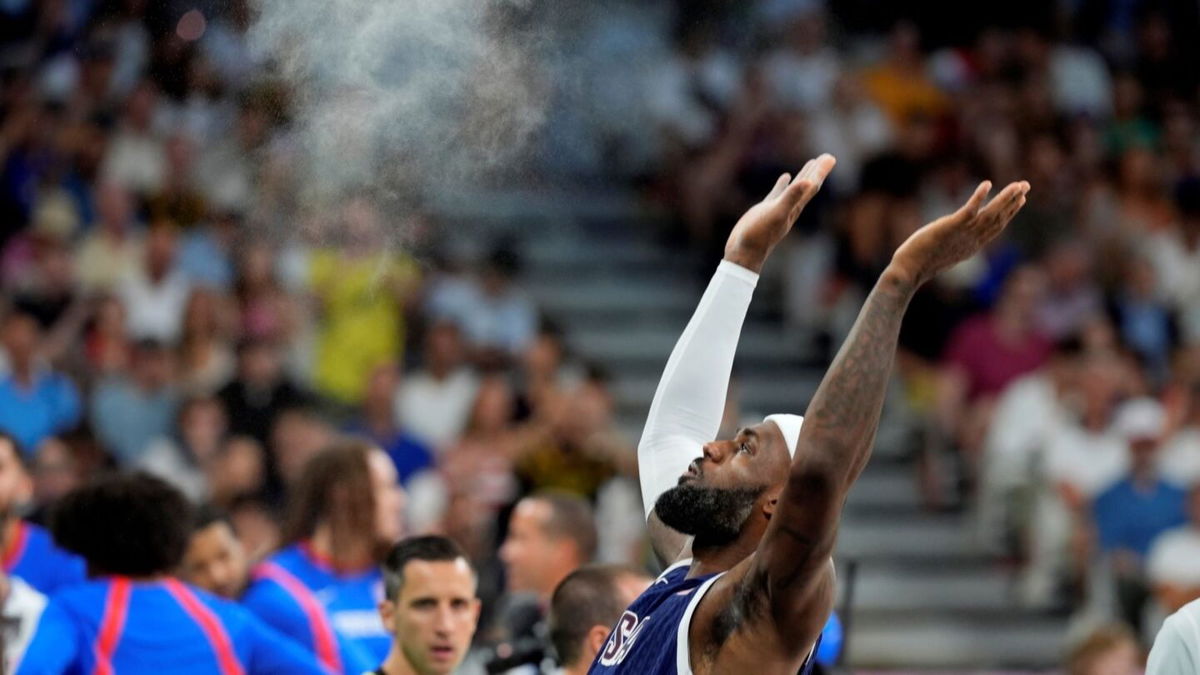 LeBron James tosses chalk before Puerto Rico game