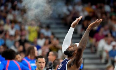 LeBron James tosses chalk before Puerto Rico game