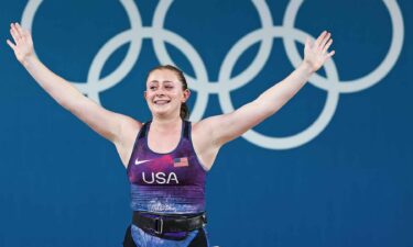 American weightlifter Olivia Reeves celebrates winning a gold medal in the women's 71kg (156 lbs.) competition.