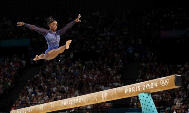 Simone Biles competes on balance beam during the all-around final at the 2024 Paris Olympics.