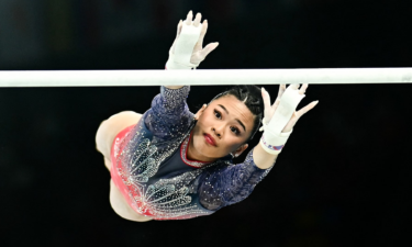 Suni Lee competes on the uneven bars during the women's all around final at the Paris 2024 Olympic Games.