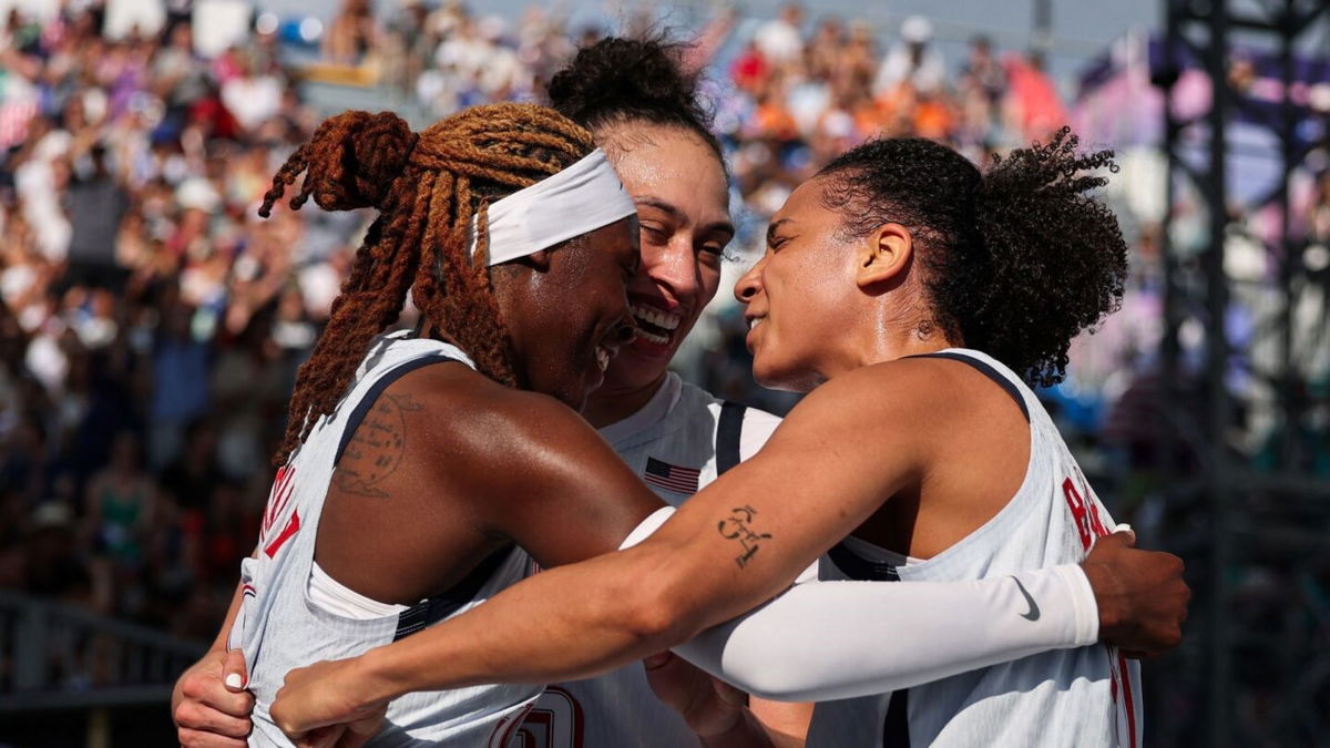 The U.S. women's 3x3 basketball team celebrates a win