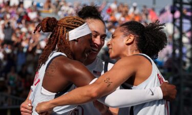 The U.S. women's 3x3 basketball team celebrates a win