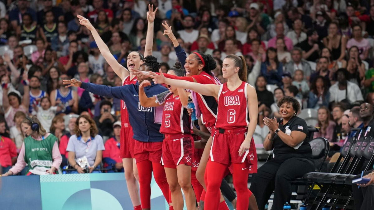 Sabrina Ionescu and the U.S. bench celebrate vs. Germany