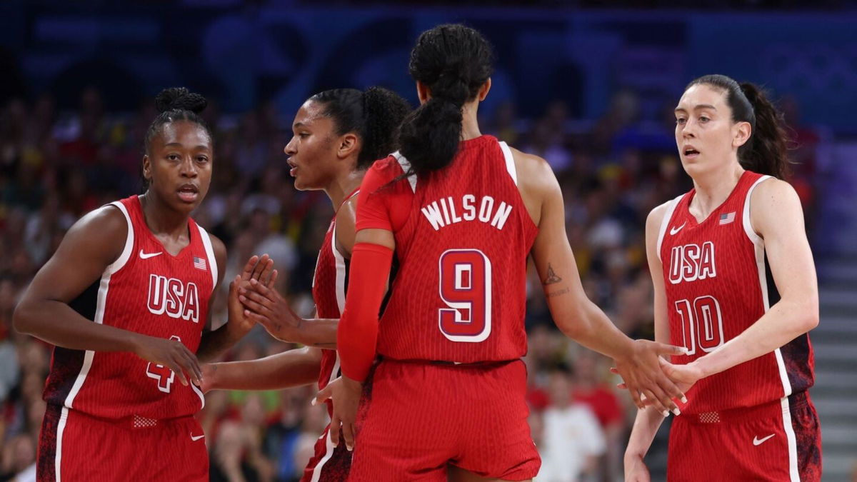 A'ja Wilson huddles with the U.S. team