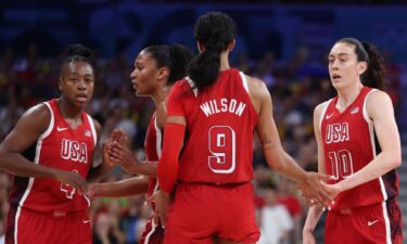 A'ja Wilson huddles with the U.S. team