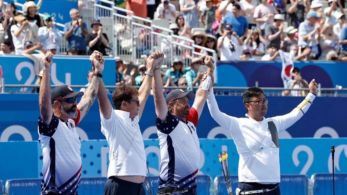 Brady Ellison looks at the crowd after an Olympic archery event