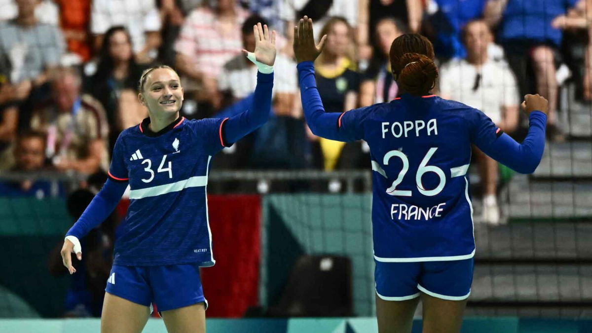 France women's handball athletes celebrate after a win