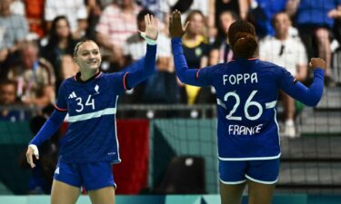 France women's handball athletes celebrate after a win