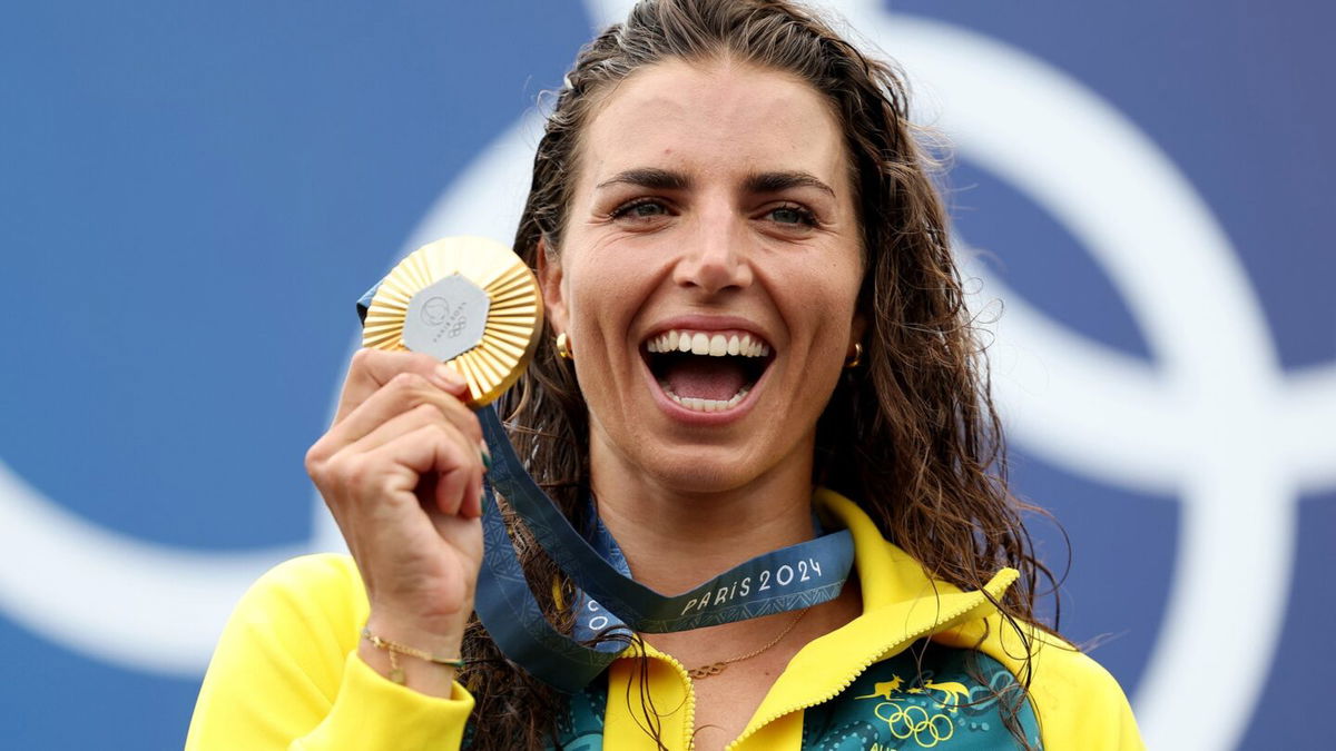 Australia's Jessica Fox posts with her gold medal for the women's canoe slalom single event at the 2024 Paris Olympics.