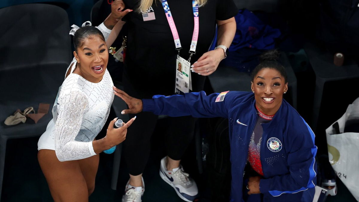 Jordan Chiles and Simone Biles of Team USA celebrate their bronze and silver medals