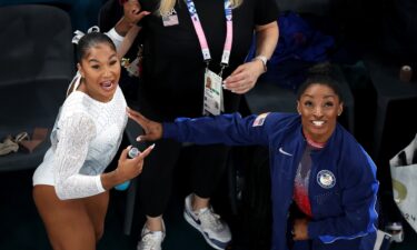 Jordan Chiles and Simone Biles of Team USA celebrate their bronze and silver medals