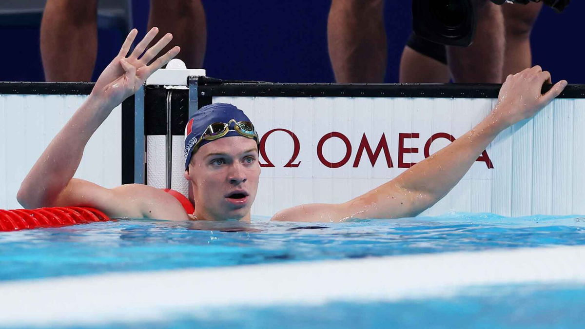 Leon Marchand of France celebrates after winning gold in the men's 200m IM.