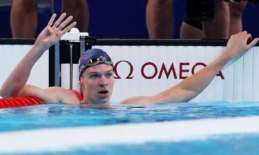 Leon Marchand of France celebrates after winning gold in the men's 200m IM.