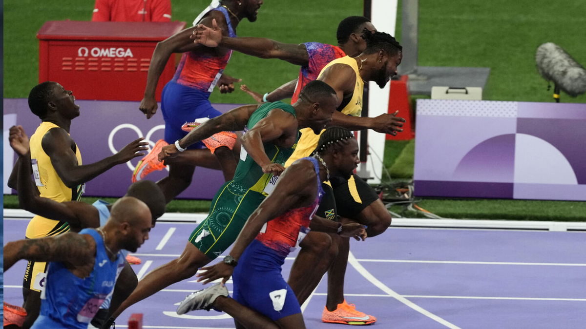 Noah Lyles wins first Olympic title, takes 100m gold in epic photo