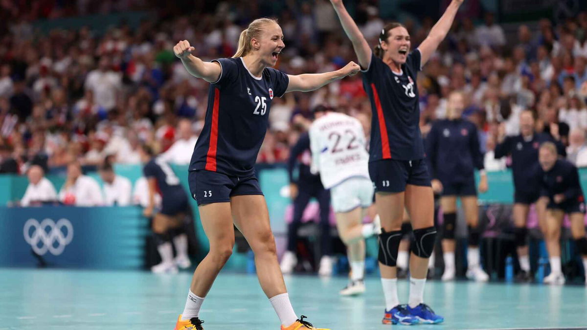 Norway players celebrate winning a handball match