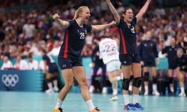 Norway players celebrate winning a handball match