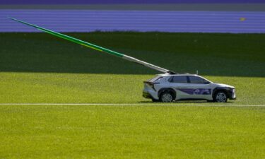 A mini-car carrying the javelins is seen during a test event for the 2024 Paris Olympics.