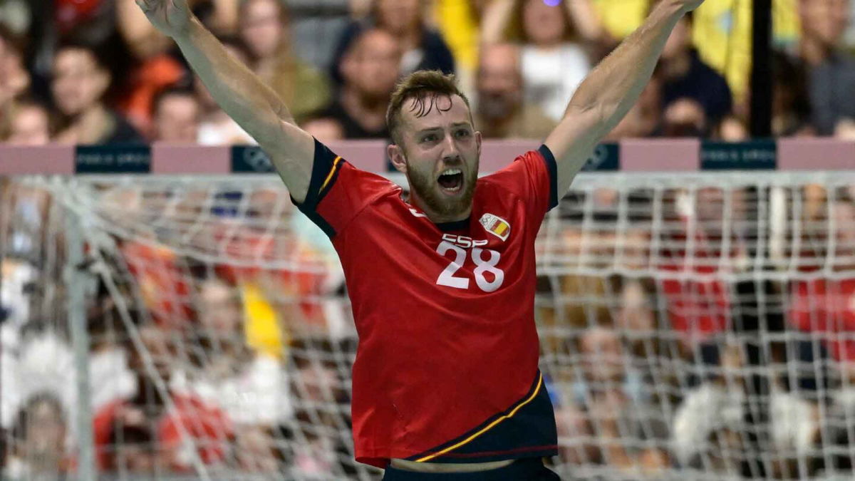 Spain handball player celebrates after scoring a goal