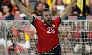 Spain handball player celebrates after scoring a goal