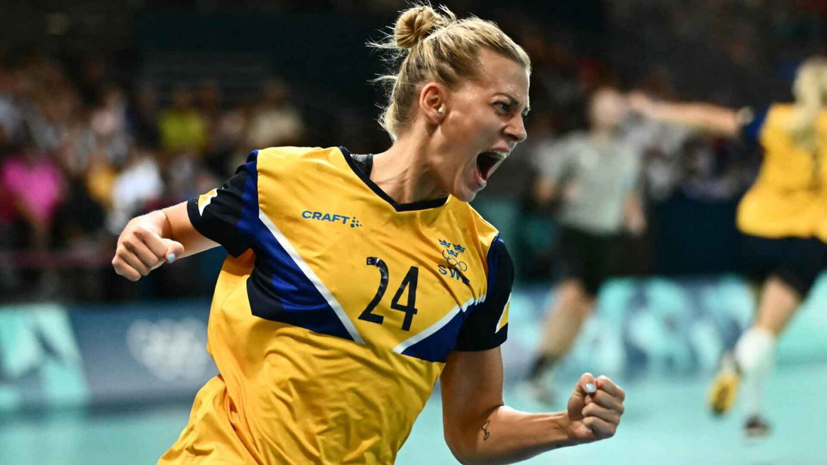 Handball player celebrates after scoring