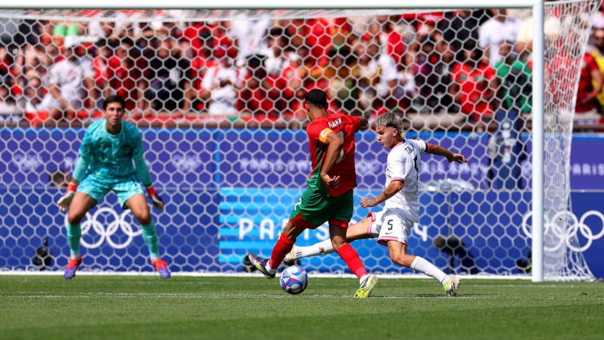 Achraf Hakimi shoots the ball.