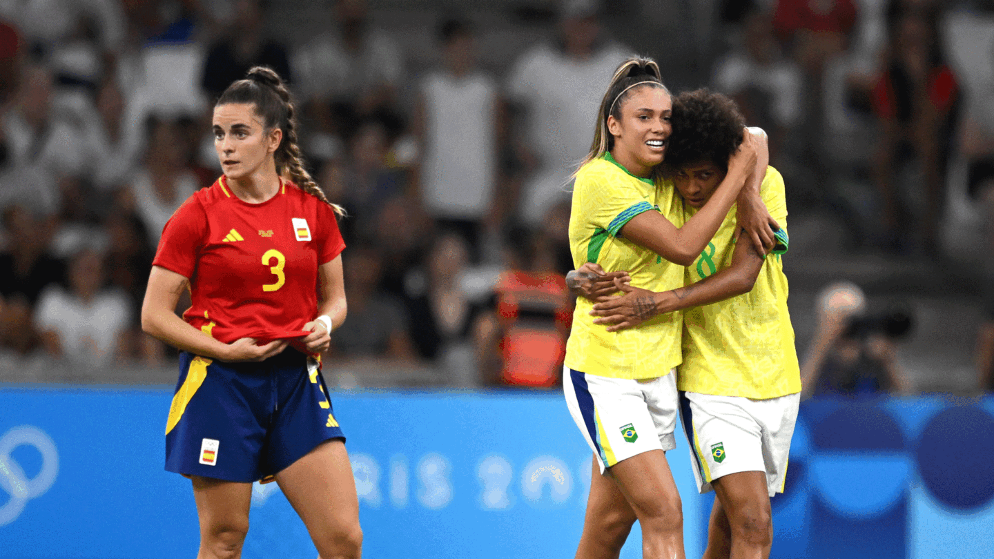 Priscila and Vitoria Yaya celebrate yellow-clad Brazil's second goal against Spain.