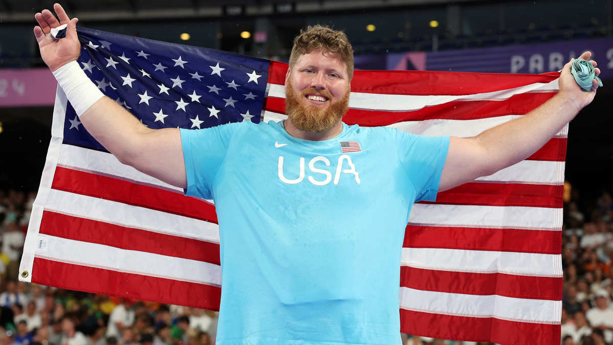 Gold medalist Ryan Crouser celebrates following his third shot put gold medal at Stade de France.